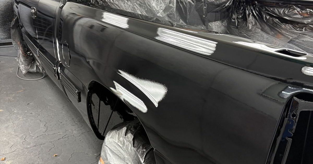 Pickup masked and ready in the paint booth