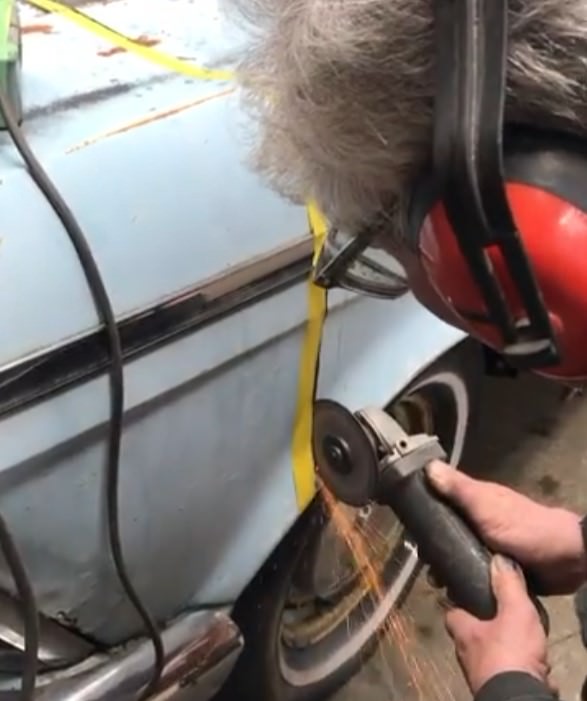 Man cutting a Rambler’s metal body with a rotating cutting disc for a custom office desk